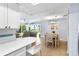 Open living space with dining area, living room and beach view at 6312 Midnight Pass Rd # 102S, Sarasota, FL 34242