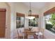 Cozy breakfast nook filled with natural light from the windows, perfect for enjoying your morning coffee at 7419 Birds Eye Ter, Bradenton, FL 34203