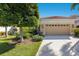 Charming single-Gathering home with a two-car garage, beautiful landscaping, and a terracotta roof at 7419 Birds Eye Ter, Bradenton, FL 34203