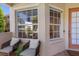 Cozy front porch area with comfortable seating and plenty of natural light at 7419 Birds Eye Ter, Bradenton, FL 34203