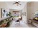 Stylish living room featuring modern decor, a comfortable green sofa, and natural light from the window at 7419 Birds Eye Ter, Bradenton, FL 34203