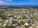 Aerial view of neighborhood homes near a beach under a bright sunny sky at 760 Azure Rd, Venice, FL 34293