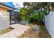 Private backyard featuring a patio and lush greenery, ideal for relaxation and outdoor activities at 760 Azure Rd, Venice, FL 34293
