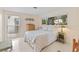 Cozy bedroom featuring a large window and an inviting bed with patterned comforter at 760 Azure Rd, Venice, FL 34293