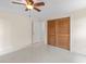 Neutral bedroom with ceiling fan and closet at 760 Azure Rd, Venice, FL 34293