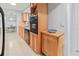Functional kitchen featuring wooden cabinets, sleek countertops, and modern appliances at 760 Azure Rd, Venice, FL 34293
