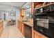 Spacious kitchen with wooden cabinetry, granite countertops, and stainless steel appliances at 760 Azure Rd, Venice, FL 34293