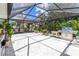 Enjoy Florida evenings in this spacious lanai with pavers, grill, and seating for friends and Gathering at 760 Azure Rd, Venice, FL 34293