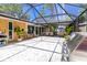 Spacious screened lanai with ample seating and a grill at 760 Azure Rd, Venice, FL 34293