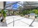 Spacious screened lanai featuring ample seating and outdoor cooking area, perfect for entertaining at 760 Azure Rd, Venice, FL 34293