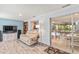 Cozy living room with a comfortable couch, entertainment center, and access to the dining area at 760 Azure Rd, Venice, FL 34293