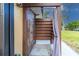 Enjoy the outdoors with this private shower featuring stone and wood, surrounded by lush greenery at 760 Azure Rd, Venice, FL 34293