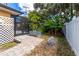 This patio offers a paver path, privacy screening, and room for gardening at 760 Azure Rd, Venice, FL 34293