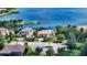 Waterfront house with lush landscaping, palm trees and cul-de-sac at 7665 Haddington Cv, Bradenton, FL 34202
