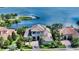 Beautiful home on the water with lush landscaping and a circular driveway at 7665 Haddington Cv, Bradenton, FL 34202