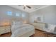 Bedroom with three windows and a Queen sized bed at 7665 Haddington Cv, Bradenton, FL 34202