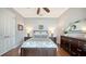 Bright bedroom with a Queen bed and two side tables at 7665 Haddington Cv, Bradenton, FL 34202