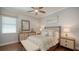 Stylishly decorated bedroom with ceiling fan, ample natural light and wood flooring at 7665 Haddington Cv, Bradenton, FL 34202