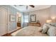 Nicely decorated bedroom featuring ceiling fan, wood flooring, and ensuite bathroom at 7665 Haddington Cv, Bradenton, FL 34202