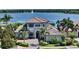 Beautiful two-story home with manicured landscaping and palm trees at 7665 Haddington Cv, Bradenton, FL 34202