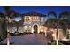 Elegant two-story home featuring manicured landscaping and a grand entrance at 7665 Haddington Cv, Bradenton, FL 34202