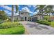 Beautiful two-story home with a well-manicured lawn, mature landscaping, and a spacious driveway at 7665 Haddington Cv, Bradenton, FL 34202