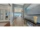 Hallway featuring a beautiful view into the living room and outdoor water view at 7665 Haddington Cv, Bradenton, FL 34202