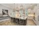 Gorgeous kitchen with a large center island and bar stool seating, pendant lighting at 7665 Haddington Cv, Bradenton, FL 34202