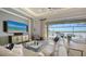Spacious living room with lots of seating and an expansive water view at 7665 Haddington Cv, Bradenton, FL 34202