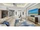 Well-lit living room with a comfortable sofa, stylish rug, and decorative cabinet, creating a cozy and inviting space at 7665 Haddington Cv, Bradenton, FL 34202