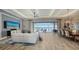 Spacious living room with lots of seating and an expansive water view at 7665 Haddington Cv, Bradenton, FL 34202