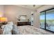 Main bedroom featuring view of the lake at 7665 Haddington Cv, Bradenton, FL 34202