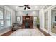 Office features a ceiling fan, a desk with a chair, a rug, and window with blinds at 7665 Haddington Cv, Bradenton, FL 34202