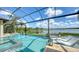 Enjoy the beautiful pool and lake views with comfortable seating at 7665 Haddington Cv, Bradenton, FL 34202