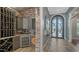 Charming wine cellar with custom racks, cabinets, and a wine refrigerator, perfect for storing and displaying your wine collection at 7665 Haddington Cv, Bradenton, FL 34202