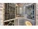 Elegant wine cellar with brick accents, custom shelving, cabinets, and a built-in cooler, ideal for wine enthusiasts at 7665 Haddington Cv, Bradenton, FL 34202