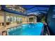 Expansive screened-in pool and patio area with multiple seating and dining spaces, ideal for entertaining and relaxation at 7665 Haddington Cv, Lakewood Ranch, FL 34202