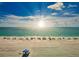 Scenic aerial view of the Lido Key beach with beach umbrellas on the sandy shore at 800 S Blvd Of The Presidents # 16, Sarasota, FL 34236