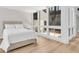 Cozy bedroom with queen bed, wood floors, and an abundance of natural light at 800 S Blvd Of The Presidents # 16, Sarasota, FL 34236