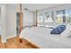 Comfortable bedroom featuring a four poster bed and window views at 800 S Blvd Of The Presidents # 16, Sarasota, FL 34236