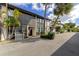 Beautiful exterior showing the building design with palm trees enhancing curb appeal, complemented by a well-maintained driveway at 800 S Blvd Of The Presidents # 16, Sarasota, FL 34236