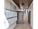Exterior view of a community hallway with multiple mailboxes and a gated entrance at 800 S Blvd Of The Presidents # 16, Sarasota, FL 34236