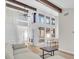 Spacious living area with soaring ceilings, natural light, and an open-concept design that enhances the modern feel at 800 S Blvd Of The Presidents # 16, Sarasota, FL 34236