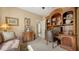 Comfortable bedroom with a large bookcase perfect for reading and relaxing at 8183 Nice Way, Sarasota, FL 34238