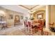Formal dining room featuring elegant furnishings, a chandelier, and neutral paint at 8183 Nice Way, Sarasota, FL 34238