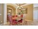 Formal dining room with a chandelier, neutral paint and tile flooring at 8183 Nice Way, Sarasota, FL 34238
