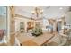 Dining area showcasing open flow to the living room and kitchen, perfect for Gathering gatherings at 8183 Nice Way, Sarasota, FL 34238