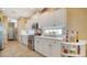 Bright kitchen featuring white cabinets, modern appliances, and ample counter space for cooking at 8183 Nice Way, Sarasota, FL 34238