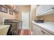 Well-equipped laundry room with modern appliances and ample storage cabinets at 8183 Nice Way, Sarasota, FL 34238