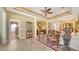 Bright living room with elegant decor, tile flooring and open floor plan at 8183 Nice Way, Sarasota, FL 34238